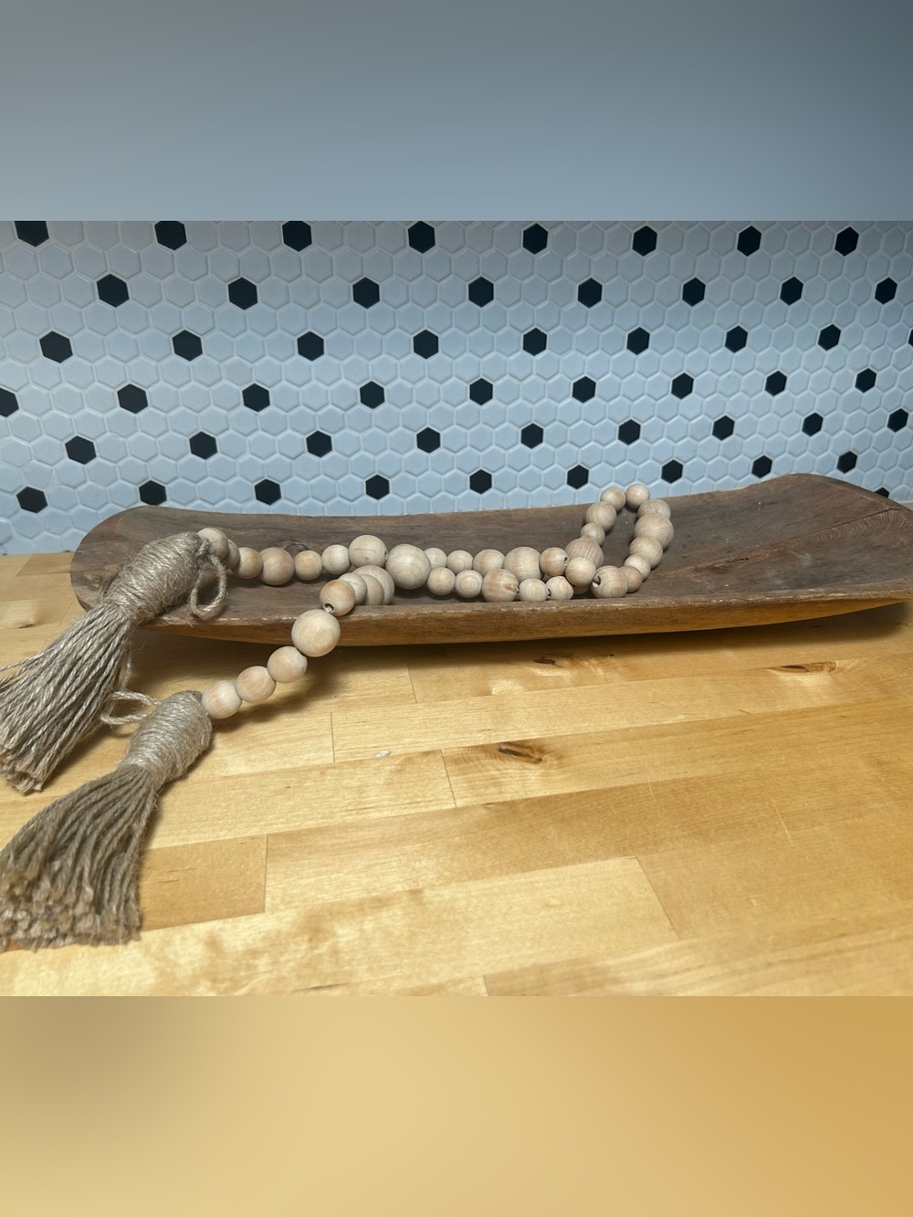 Vintage bread bowl with decorative wooden beads.